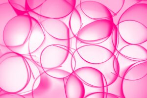 Vibrant abstract pink circles forming a textured background, perfect for modern and artistic designs.